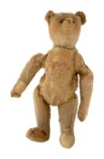 A small light brown Steiff bear