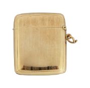 A George V 9ct gold engine turned vesta case