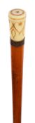 An early 19th century pique work inlaid ivory topped walking cane