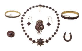 A Bohemian garnet and gilt metal necklace, bangles, brooch earrings