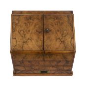 A Victorian walnut and figured walnut stationery cabinet