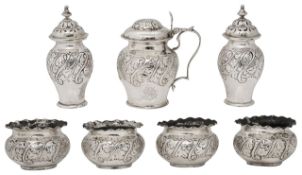 A late Victorian silver seven piece cruet set
