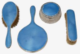 A George VI silver and blue guilloche enamel four piece dressing table set