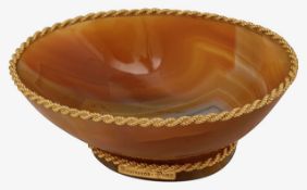 Boucheron. Paris. A small gold mounted banded russet agate dish