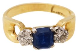 A sapphire and diamond three stone ring