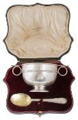 A George V cased silver porringer and spoon