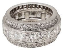 An impressive triple full hoop diamond-set eternity ring