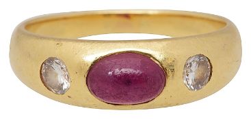 A ruby and diamond three stone ring