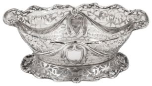 A late Victorian pierced silver footed twin handled basket
