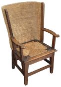 An early 20th century oak framed child's Orkney chair