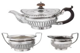 A late Victorian silver three piece bachelors tea service