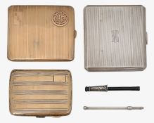 A group of silver cigarette cases