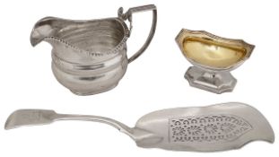 A George III silver provincial cream jug, a pedestal salt and a fiddle pattern fish slice