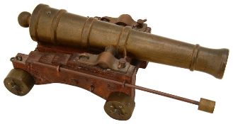 An early 20th century bronze table top model signalling cannon