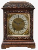 An early 20th century figured walnut cased mantel clock