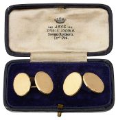 A pair of gold oval cufflinks