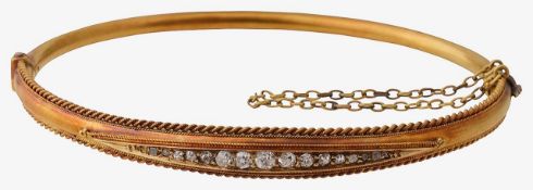 A late Victorian 15ct gold and diamond set hinged bangle