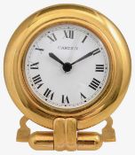 Must de Cartier. A gilt brass Colisse travel alarm clock