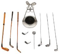 A collection of Edwardian silver and other golfing hat pins and brooches