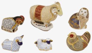 A collection of six Royal Crown Derby paperweights