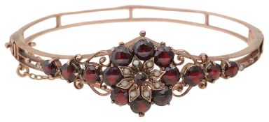 A garnet open-work bangle