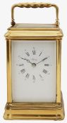 A large French gilt brass carriage clock retailed by Asprey
