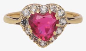 A synthetic ruby and white stone ring