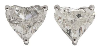 A pair of diamond single stone studs
