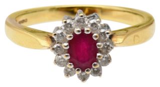 An 18ct gold ruby and diamond cluster ring