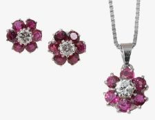 A ruby and diamond pendant with matching ear studs