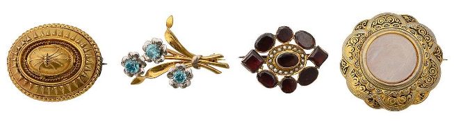 A collection of four brooches