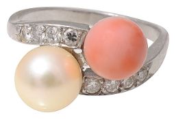 An early 20th century cultured pearl and coral diamond-set cross-over ring