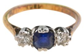 A sapphire and diamond three stone ring