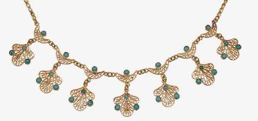 A gold and turquoise fringe necklace