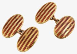 A pair of gold enamelled oval cufflinks