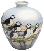 A modern Moorcroft potter 'Puffin' vase designed by Carole Lovetts