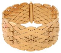 A wide 18ct gold articulated bracelet