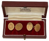 A pair of 9ct gold oval cufflinks