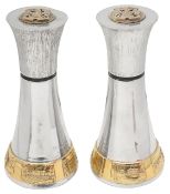 A pair of large Elizabeth II Modernist silver and parcel gilt pepper mills