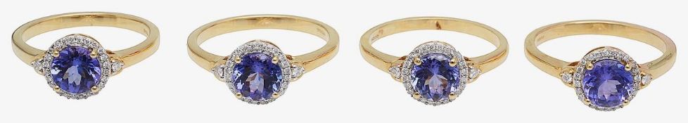 Four 18ct gold and tanzanite set cluster rings