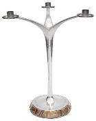 An Elizabeth II Modernist silver and parcel-gilt three light candelabra