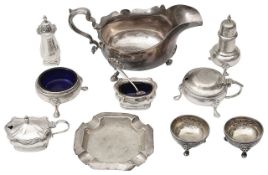 A large George V silver sauce boat, cruet sets and other silver
