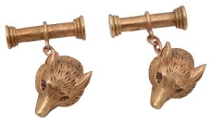 A pair of fox head cufflinks
