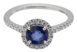 A sapphire and diamond halo ring by Mappin & Webb