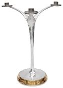 An Elizabeth II Modernist silver and parcel-gilt three light candelabra