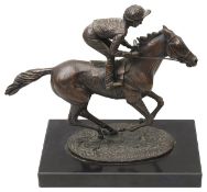 A limited edition Franklin Mint bronze figure 'Champion Finish'