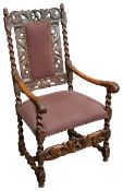 A Charles II carved walnut open armchair
