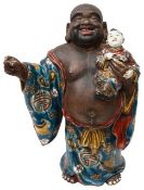 A late 19th century Japanese Meiji period porcelain figure of Hotei and Karako