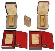 Five gold plated Dunhill and S J Dupont 'Rollargas' cigarette lighters