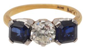 A sapphire and diamond three stone ring